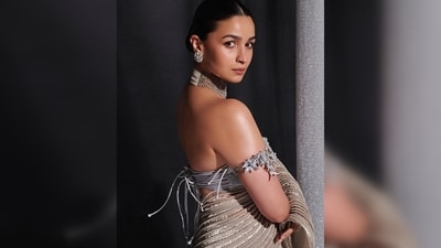 Alia Bhatt's saree has a metallic shine with pleats. She teamed it with an embroidered bandeau blouse. (Instagram/@aliaabhatt) Alia Bhatt's saree has a metallic shine with pleats. She teamed it with an embroidered bandeau blouse. (Instagram/@aliaabhatt)
