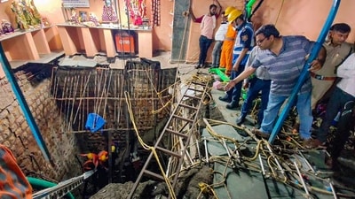 Indore: Rescue operation underway after the roof of a 'bavdi' (well) collapsed at Beleshwar Mahadev Jhulelal, in Indore, Thursday, March 30, 2023. (PTI) Indore: Rescue operation underway after the roof of a 'bavdi' (well) collapsed at Beleshwar Mahadev Jhulelal, in Indore, Thursday, March 30, 2023. (PTI)