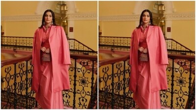 Sonam further accessorised her look for the day in a golden neck choker and matching satement earrings from the shelves of The Gem Palace. She decked up in vintage pearls from her mom Sunita Kapoor’s collection. She also carried a pink and silver mini clutch. (Instagram/@sonamkapoor) Sonam further accessorised her look for the day in a golden neck choker and matching satement earrings from the shelves of The Gem Palace. She decked up in vintage pearls from her mom Sunita Kapoor’s collection. She also carried a pink and silver mini clutch. (Instagram/@sonamkapoor)