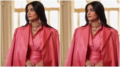 Sonam looked every bit gorgeous in a pink satin shirt tucked inside a high-waisted matching pink satin skirt with gathered details at the waist. (Instagram/@sonamkapoor) Sonam looked every bit gorgeous in a pink satin shirt tucked inside a high-waisted matching pink satin skirt with gathered details at the waist. (Instagram/@sonamkapoor)