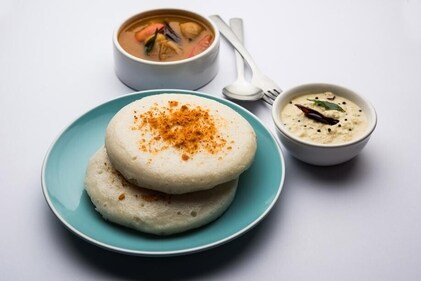 A delicacy in Karnataka, thatte idlis — flattened, disc-shaped and steamed in plates — are often enjoyed smeared in podi (gun powder) (Shutterstock )