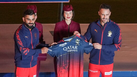 Royal Challengers Bangalore (RCB) captain Faf Du Plesis with teammate Virat Kohli during the unveiling of team jersey, at Chinnaswamy Stadium, in Bengaluru. (PTI)