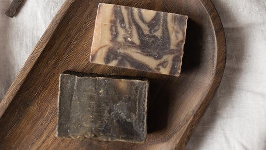 Charcoal soap helps remove impurities from skin effectively. (Pexels)