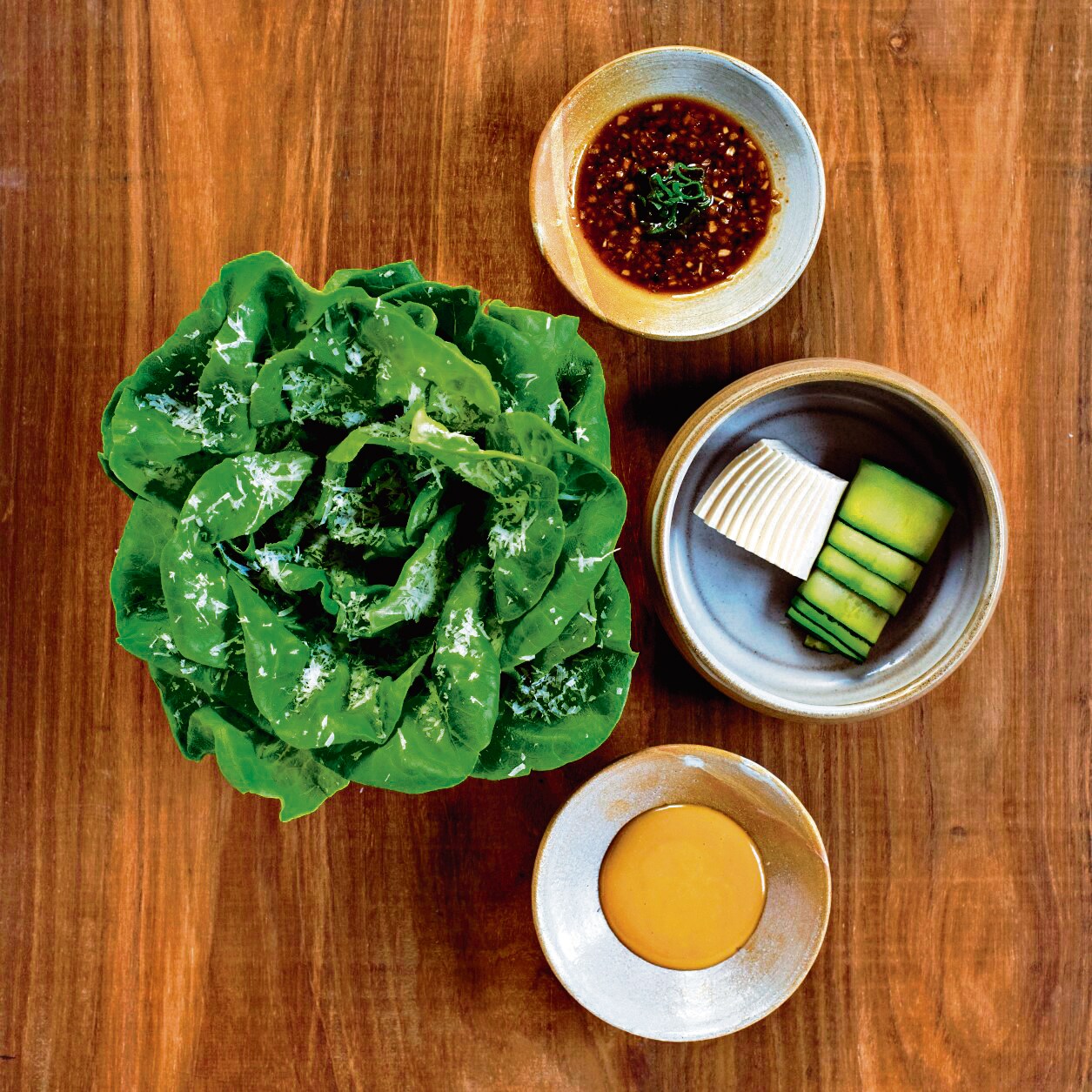 Butterhead lettuce with grana, silken tofu and zucchini, a sesame-based dressing and a Japanese Negi dressing. Butterhead lettuce with grana, silken tofu and zucchini, a sesame-based dressing and a Japanese Negi dressing.