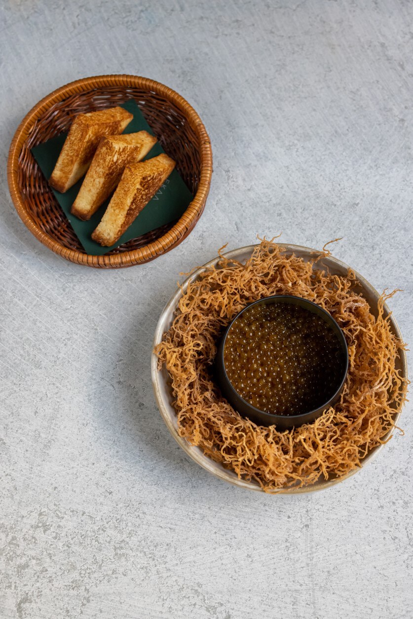 On the menu: Liver pâte, cilantro and soy served on a bed of seaweed. On the menu: Liver pâte, cilantro and soy served on a bed of seaweed.