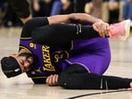  Los Angeles Lakers forward Anthony Davis (3) grabs his ankle during the third quarter against the Minnesota Timberwolves at Target Center. 