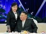 Kim Jong Un: North Korean leader Kim Jong Un talks with his daughter Kim Ju Ae at a banquet.