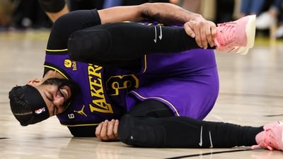 Los Angeles Lakers forward Anthony Davis (3) grabs his ankle during the third quarter against the Minnesota Timberwolves at Target Center. (USA TODAY Sports via Reuters Con)
