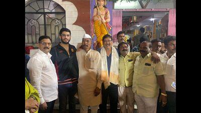 Ikram Khan (fourth from right) and his son Ahad (second from right) at the Hanuman temple in Kalyaninagar. (HT PHOTO)