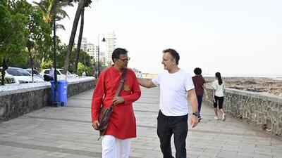 Mumbai, India - March 28, 2023: Indian English poet, novelist and story writer Jerry Pinto walks with India-based British entrepreneur Matthew Spacie, co-founder of Clearstrip, on the promenade along the Arabian sea, at Bandstand, Bandra (West), in Mumbai, India, on Tuesday, March 28, 2023. (Photo by Vijay Bate/HT Photo) (HT PHOTO) Mumbai, India - March 28, 2023: Indian English poet, novelist and story writer Jerry Pinto walks with India-based British entrepreneur Matthew Spacie, co-founder of Clearstrip, on the promenade along the Arabian sea, at Bandstand, Bandra (West), in Mumbai, India, on Tuesday, March 28, 2023. (Photo by Vijay Bate/HT Photo) (HT PHOTO)