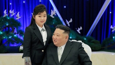 Kim Jong Un: North Korean leader Kim Jong Un talks with his daughter Kim Ju Ae at a banquet. (Reuters)