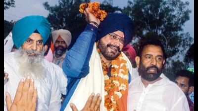 Punjab Congress leader Navjot Singh Sidhu on Saturday evening walked free after spending nearly 10 months in Patiala Central Jail in a 1988 road rage case and targeted the Centre and Punjab government, alleging that democracy is in chains and institutions have turned slaves in the country.