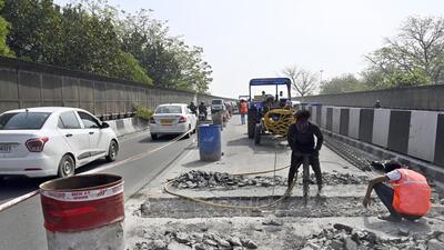 Workers conduct repair work at Chirag Delhi flyover on Saturday. The repair work on the Chirag Delhi flyover, a key stretch of the Outer Ring Road, began on March 12, with a 50-day deadline. (Sanjeev Verma/ HT Photo) Workers conduct repair work at Chirag Delhi flyover on Saturday. The repair work on the Chirag Delhi flyover, a key stretch of the Outer Ring Road, began on March 12, with a 50-day deadline. (Sanjeev Verma/ HT Photo)