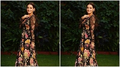 Dia looked every bit stunning in the black gown featuring translucent full sleeves, and embroidery details in multicoloured floral patterns throughout the length of the dress. (Instagram/@diamirzaofficial) Dia looked every bit stunning in the black gown featuring translucent full sleeves, and embroidery details in multicoloured floral patterns throughout the length of the dress. (Instagram/@diamirzaofficial)