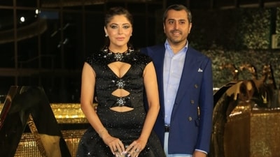 Singer Kanika Kapoor made a rare appearance with husband Gautam Hathiramani at the NMACC launch. She was in a black dress while he was in formals. (Varinder Chawla) Singer Kanika Kapoor made a rare appearance with husband Gautam Hathiramani at the NMACC launch. She was in a black dress while he was in formals. (Varinder Chawla)