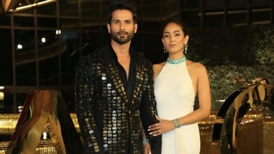 Shahid Kapoor and Mira Rajput too made a powerful appearance in black and white. While Shahid wore black formals with a metallic blazer, Mira wore a white gown with a train. (Varinder Chawla) Shahid Kapoor and Mira Rajput too made a powerful appearance in black and white. While Shahid wore black formals with a metallic blazer, Mira wore a white gown with a train. (Varinder Chawla)