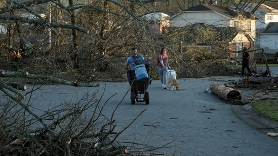 Residents evacuate their neighbourhood after a large tornado damaged hundreds of homes and buildings on March 31 in Little Rock, Arkansas.(Getty Images via AFP)