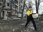 A local resident walks next to a damaged residential building after a Russian missile strike in the town of Kostyantynivka, in the Donetsk region, on April 2, 2023, amid the Russian invasion of Ukraine. A local resident walks next to a damaged residential building after a Russian missile strike in the town of Kostyantynivka, in the Donetsk region, on April 2, 2023, amid the Russian invasion of Ukraine.