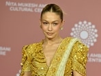 In this picture taken on April 1, 2023, US model Gigi Hadid poses for pictures during the inauguration of the Nita Mukesh Ambani Cultural Centre (NMACC) at the Jio World Centre (JWC) in Mumbai. (Photo by SUJIT JAISWAL / AFP) In this picture taken on April 1, 2023, US model Gigi Hadid poses for pictures during the inauguration of the Nita Mukesh Ambani Cultural Centre (NMACC) at the Jio World Centre (JWC) in Mumbai. (Photo by SUJIT JAISWAL / AFP)