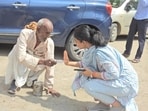 IAS Saumya Pandey seen interacting with the elderly man. IAS Saumya Pandey seen interacting with the elderly man.