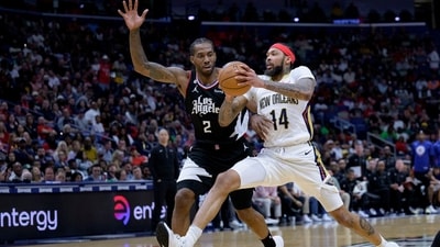 New Orleans Pelicans forward Brandon Ingram (14) drives around Los Angeles Clippers forward Kawhi Leonard (2) during the second half of an NBA basketball game in New Orleans, Saturday, April 1, 2023. (AP) New Orleans Pelicans forward Brandon Ingram (14) drives around Los Angeles Clippers forward Kawhi Leonard (2) during the second half of an NBA basketball game in New Orleans, Saturday, April 1, 2023. (AP)
