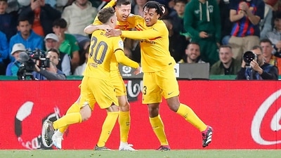 Robert Lewandowski (C) celebrates with Gavi (L) and Jules Kounde scoring his team's third goal (AFP) Robert Lewandowski (C) celebrates with Gavi (L) and Jules Kounde scoring his team's third goal (AFP)