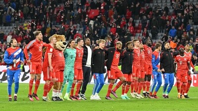 Bayern Munich's team celebrates after the German first division Bundesliga football match between FC Bayern Munich and BVB Borussia Dortmund (AFP)