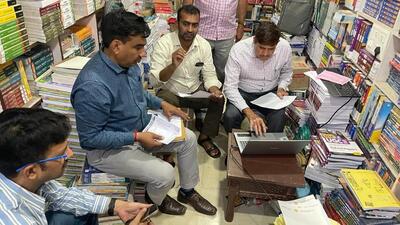 Gurugram, India-April 01, 2023: The chief minister’s flying squad, police and team of National Council of Educational Research and Training (NCERT) conducted raid in at least six shopkeepers at Sadar Bazaar who were allegedly selling pirated NCERT books for classes 6 to 12 near post office, in Gurugram, India, on Saturday, 01 April 2023. (Photo by Parveen Kumar/Hindustan Times)