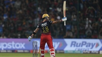 Virat Kohli celebrates after scoring fifty during the Indian Premier League match between Royal Challengers Bangalore and Mumbai Indians in Bengaluru (AP)