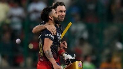 Virat Kohli celebrates with Glenn Maxwell as they leave the field after Royal Challengers Bangalore's win in Indian Premier League match against Mumbai Indians (AP)