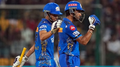Mumbai Indians batter Tilak Varma celebrates his fifty during IPL 2023 match against Royal Challengers Bangalore (PTI)