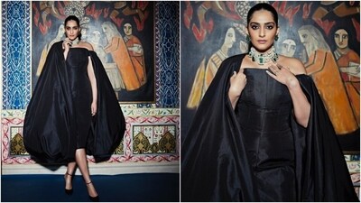 Sonam accessorised the ensemble with a pearl, emerald and diamond choker necklace, floral-shaped emerald earrings, and matching statement rings. In the end, Sonam chose a sleek bun, subtle nude eye shadow, winged eyeliner, kohl-lined eyes, mascara on the lashes, nude pink lip shade, feathered brows, rouged cheeks, dewy base, light contouring, and beaming highlighter. (Instagram) Sonam accessorised the ensemble with a pearl, emerald and diamond choker necklace, floral-shaped emerald earrings, and matching statement rings. In the end, Sonam chose a sleek bun, subtle nude eye shadow, winged eyeliner, kohl-lined eyes, mascara on the lashes, nude pink lip shade, feathered brows, rouged cheeks, dewy base, light contouring, and beaming highlighter. (Instagram)