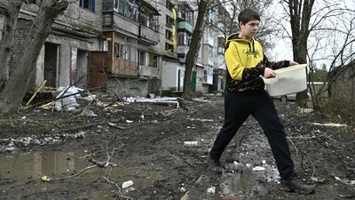 A local resident walks next to a damaged residential building after a Russian missile strike in the town of Kostyantynivka, in the Donetsk region, on April 2, 2023, amid the Russian invasion of Ukraine. (AFP) A local resident walks next to a damaged residential building after a Russian missile strike in the town of Kostyantynivka, in the Donetsk region, on April 2, 2023, amid the Russian invasion of Ukraine. (AFP)