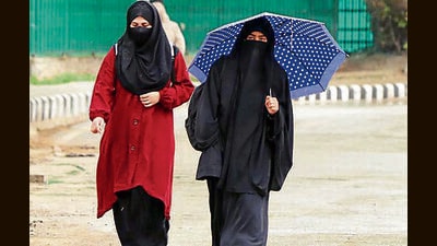 Women walk amid light showers of rain in Srinagar. After widespread rains, the weather improved in Jammu and Kashmir on Sunday though meteorological department predicted more rains from Monday. (ANI) Women walk amid light showers of rain in Srinagar. After widespread rains, the weather improved in Jammu and Kashmir on Sunday though meteorological department predicted more rains from Monday. (ANI)