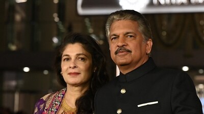 Businessman Anand Mahindra with his wife Anuradha. (AFP) Businessman Anand Mahindra with his wife Anuradha. (AFP)