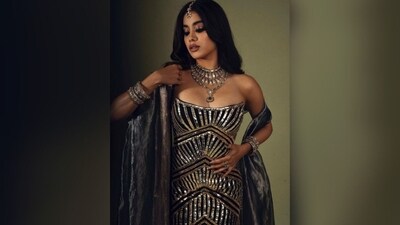 Janhvi Kapoor served as the perfect muse for fashion designer Manish Malhotra, donning a striking black gown adorned with intricate golden sequin work all over that showcased her curves perfectly. (Instagram/@Janhvikapoor) Janhvi Kapoor served as the perfect muse for fashion designer Manish Malhotra, donning a striking black gown adorned with intricate golden sequin work all over that showcased her curves perfectly. (Instagram/@Janhvikapoor)