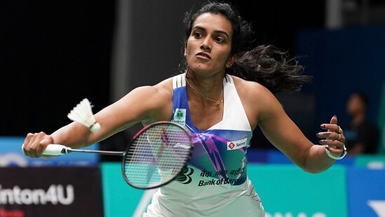 India's Pusarla V. Sindhu plays a shot against Spain's Carolina Marin during their women's singles match at the Malaysia Open badminton tournament at Bukit Jalil Axiata Arena in Kuala Lumpur(AP)