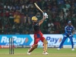 Virat Kohli goes down the ground against MI Virat Kohli goes down the ground against MI