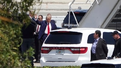 Former president Donald Trump waves before boarding his plane at Palm Beach International Airport. (AP) Former president Donald Trump waves before boarding his plane at Palm Beach International Airport. (AP)