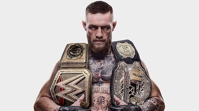 Conor McGregor posted a picture of himself holding both the UFC and WWE championship belts. (Twitter) Conor McGregor posted a picture of himself holding both the UFC and WWE championship belts. (Twitter)