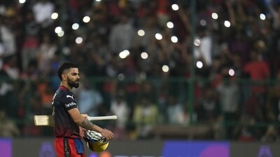 Royal Challengers Bangalore's Virat Kohli leaves the field after their win in the Indian Premier League cricket match against Mumbai Indians in Bengaluru, India, Sunday, April 2, 2023. (AP Photo/Aijaz Rahi) (AP)