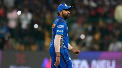 Mumbai Indians' captain Rohit Sharma reacts as he leaves the field after their loss in the Indian Premier League cricket match against Royal Challengers Bangalore in Bengaluru. (AP) Mumbai Indians' captain Rohit Sharma reacts as he leaves the field after their loss in the Indian Premier League cricket match against Royal Challengers Bangalore in Bengaluru. (AP)