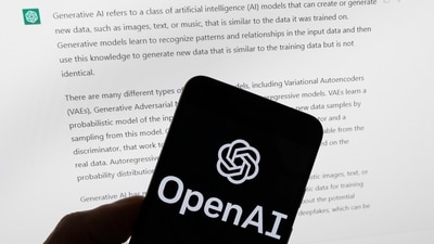 The OpenAI logo is seen on a mobile phone in front of a computer screen displaying output from ChatGPT. (AP) The OpenAI logo is seen on a mobile phone in front of a computer screen displaying output from ChatGPT. (AP)