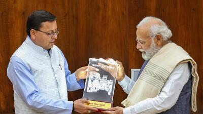 Prime Minister Narendra Modi with Uttarakhand chief minister Pushkar Singh Dhami during a meeting, in New Delhi, Monday (PTI)