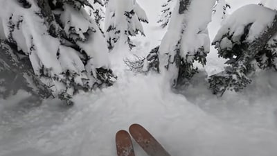 Snowboarder saves life of a man stuck in a tree well. (YouTube/@Francis Zuber ) Snowboarder saves life of a man stuck in a tree well. (YouTube/@Francis Zuber )