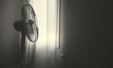 If AC is beyond you, a good tower fan should help beat the summer heat. (Unsplash)