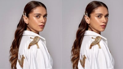 She adorned her outfit with a striking red stone studded choker necklace that added a pop of color to the ensemble. The choker was layered beautifully with a delicate gold chain necklace, adding a touch of elegance and sophistication to the overall look.&nbsp; (Instagram/@aditiraohydari)