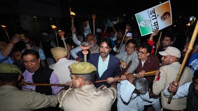 Congress leader Ghulam Ahmad Mir and others scuffle with police during party's 'Jai Bharat Satyagrah' torch rally, in Jammu, Monday. (PTI) Congress leader Ghulam Ahmad Mir and others scuffle with police during party's 'Jai Bharat Satyagrah' torch rally, in Jammu, Monday. (PTI)