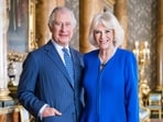 Britain's King Charles III and  Camilla pose for a photo in the Blue Drawing Room at Buckingham Palace, London.