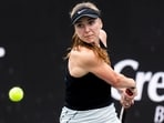 Elina Svitolina, of Ukraine, returns a shot to Yulia Putintseva, of Kazakhstan, during action at the Charleston Open tennis tournament in Charleston, S.C., Monday, April 3, 2023. (AP Photo/Mic Smith)